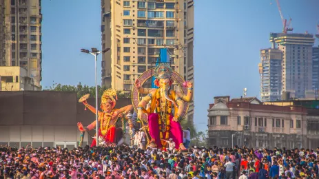 Crowds during Ganesh Visarjan festival near giant statues of the elephant-headed Hindu god