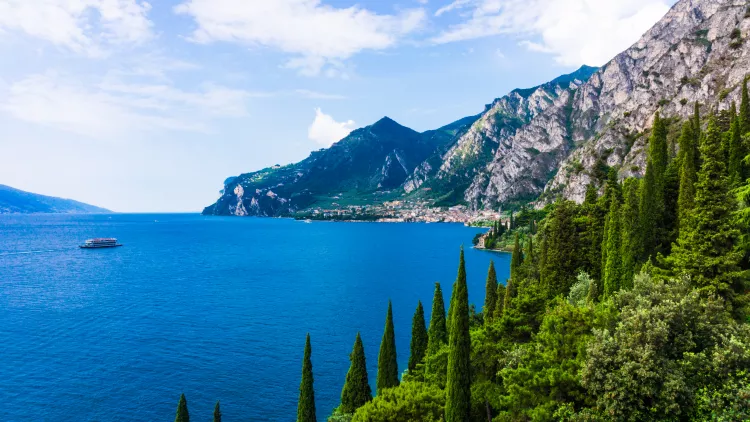 Lake Garda with mountains and vegetation in Italy