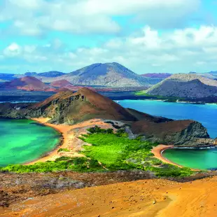 Bartolome Island surrounded by beaches and green glistening waters