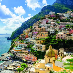 Colourful buildings on the side of the Amalfi Coast in Positano village, Italy