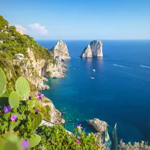 Famous Faraglioni rocks on the coast of Capri island in Italy