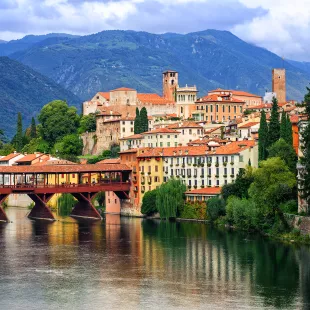 Picturesque view of buildings and the river in Bassano del Grappa, Veneto region, Italy