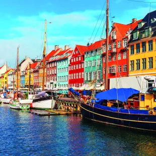 Nyhavn pier with colourful buildings, ships, yachts and other boats in the Old Town of Copenhagen, Denmark.