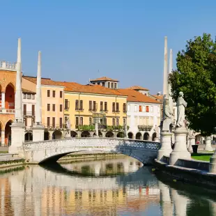 Padua city with statues and mini bridge over water, Italy