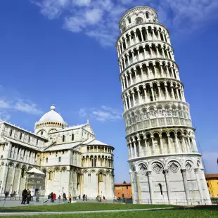 A low ground shot of the leaning tower of Pisa and the Campo dei Miracoli building, Italy