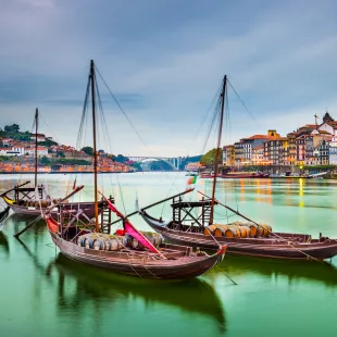 Porto cityscape on the Douro River with traditional Rabelo boats in Portugal