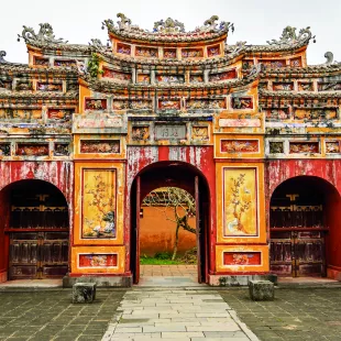 Large, colorful temple entrance to the temple Thế Miếu, Hue, Vietnam