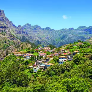 Village nestles between the copse covered mountains, Curral das Freiras