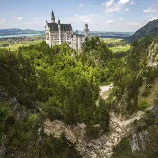 View of the Neuschwanstein fairytale like castle surrounded by greenery