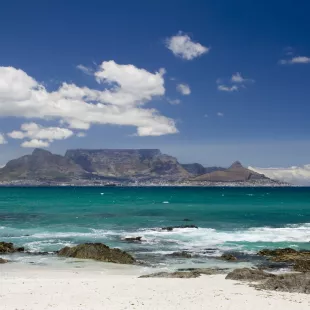 View of table mountain from a beach shore in South Africa