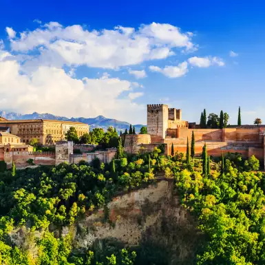 Landscape of Alhambra in Granada in Spain amid a beautiful green hilltop and blue skies