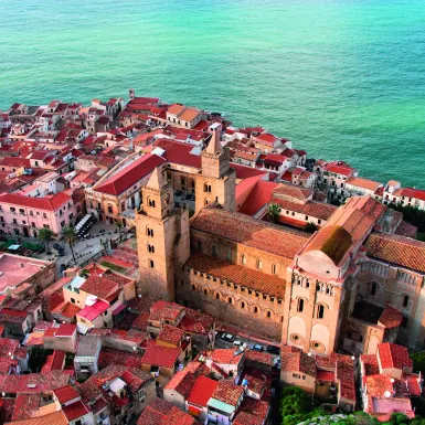 Aerial view of beautiful Mediterranean town, showcasing the Cathedral of Cefalù in Sicily, Italy