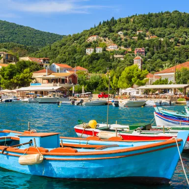 Colourful Greek fishing boats in port of Kioni on Ithaca island, Greece