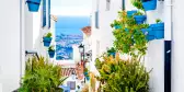 Narrow street in Mijas tourist town of the white villages in Andalusia, Spain