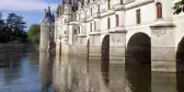 Side view of the Château de Chenonceaux and river in France