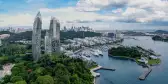 View of Singapore from above, including marina, greenery and skyscrapers