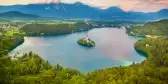 Julian Alps and Lake Bled with St. Marys Church on small island in Slovenia, Europe