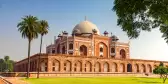 Humayun's Tomb building in the centre of a green lawns and stone pathways, New Delhi, India