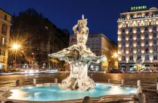 Bernini's Triton Fountain at night in front of the Sina Bernini Bristol hotel, Italy