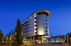 Exterior of the Novotel Tours Centre Gare hotel at night in Tours, France