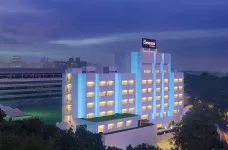 Exterior of the The Connaught hotel at night in New Delhi, India