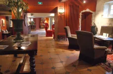 Interior of reception lounge area at Hotel Le Donjon in France