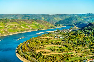 The great loop of the Rhine at Boppard in Germany, bright blue waters and hills in the distance.