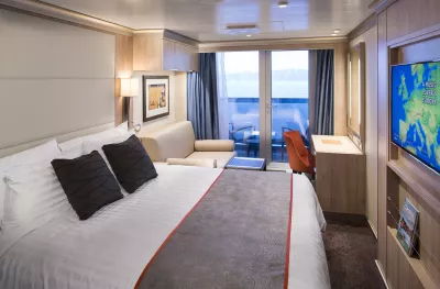 Double bed suite inside a Holland America cruise ship