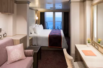 Double bedroom with window view aboard the MS Koningsdam ship