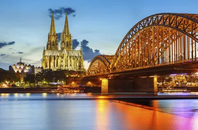 Cologne Cathedral and Hohenzollern bridge illuminated in Cologne, Germany