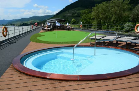 Outdoor pool and mini golf turf on the Sun Deck of the William Wordsworth ship