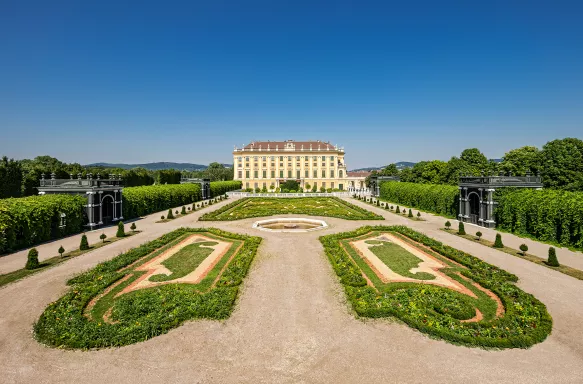 Schloss Schonbrunn Kronprinzengarten - manicured gardens in front of a grand house, Vienne, Austria