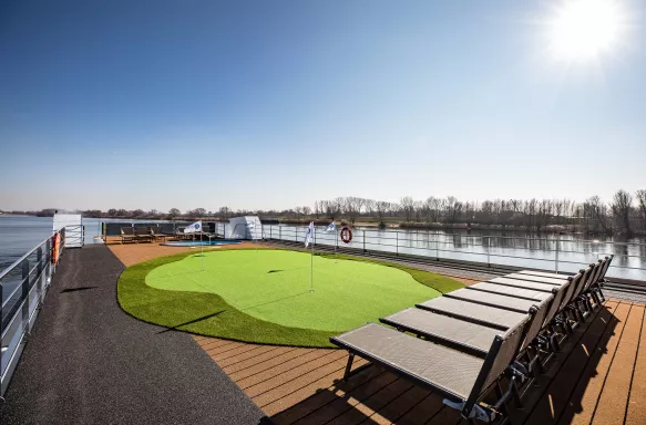 Golf putting green with sun loungers aboard the George Eliot ship