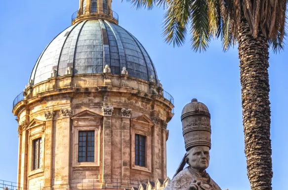 Exterior of the Palermo Cathedral with statue in Sicily, Italy