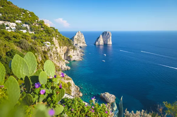 Famous Faraglioni rocks on the coast of Capri island in Italy