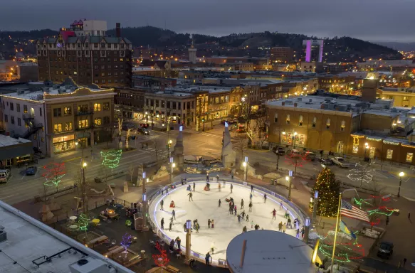 Aerial View of Christmas Lights and an outdoor ice rink at dusk in Rapid City, South Dakota, USA.