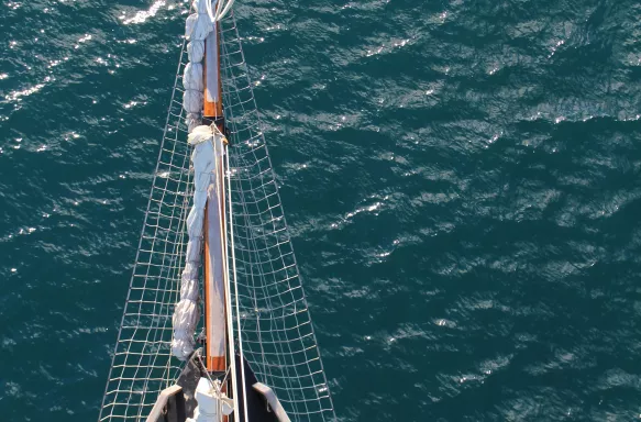 Tall ship bow overlooking the ocean on a sunny day