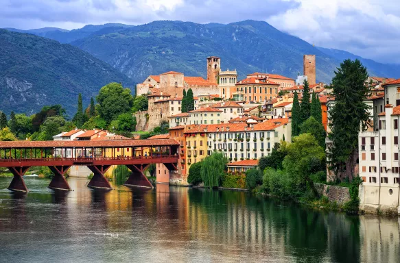 Picturesque view of buildings and the river in Bassano del Grappa, Veneto region, Italy