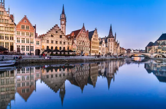 Picturesque medieval buildings overlooking the "Graslei harbor" on Leie river in Ghent town, Belgium, Europe.