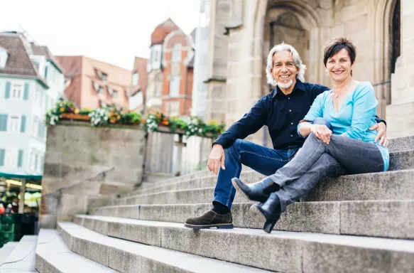 Senior couple taking a rest next to church in Tübingen, Germany