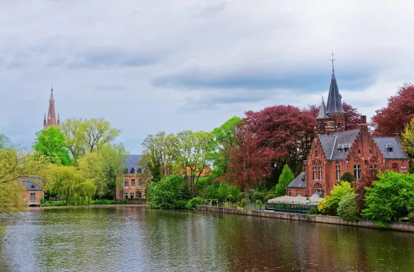 Minnewaterpark and Minnewater lake in old town of Brugge, Belgium