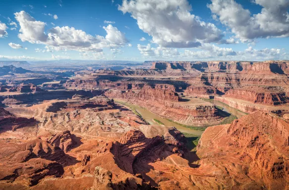 Aerial panoramic view of desert landscape canyons at the Dead Horse Point State Park with the Colorado river flowing in Utah, USA.