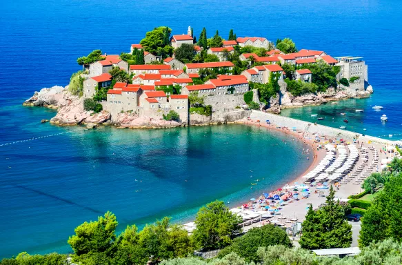 Aerial view of Sveti Stefan town and resort on the Adriatic Sea coast in Montenegro, Southeast Europe