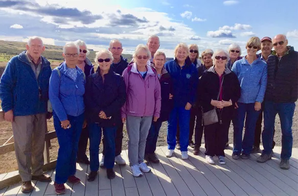 Group of senior individuals posing for a photo together