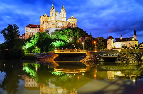 Twilight view of Melk Abbey overlooking the Danube river in Austria