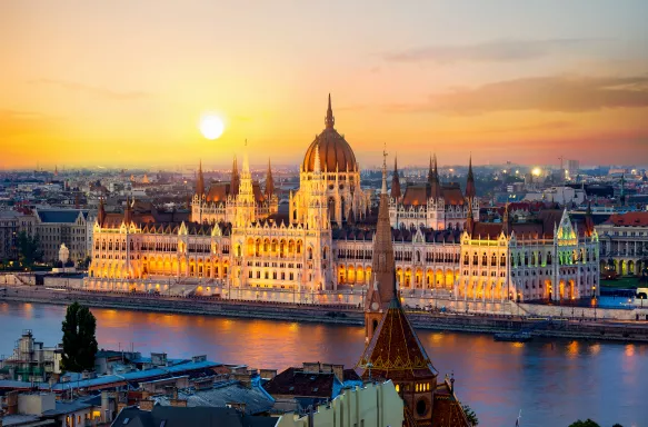 Parliament on riverbank of Danube at sunrise in Budapest, Hungary