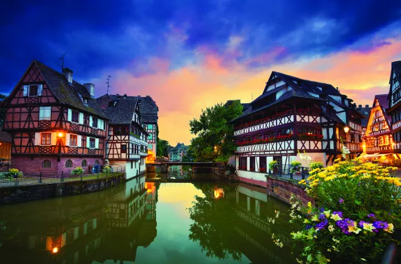 View of Strasbourg old town and river during dramatic sunset in France 