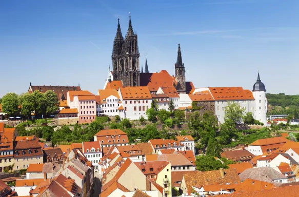 Famous Castle, Albrechtsburg, amongst white houses with orange roofs in in Meissen, Saxony, Germany.