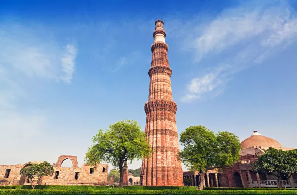 View of slender Minaret victory tower, the Qutub Minar in New Delhi, India