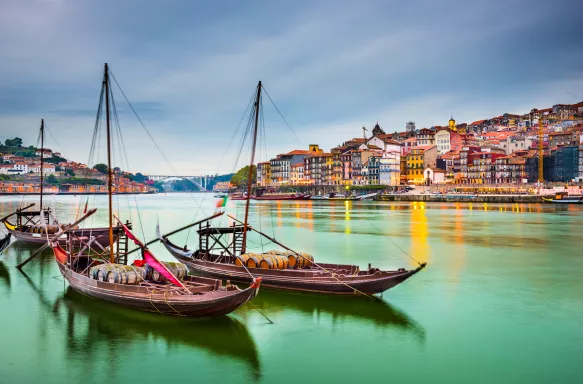 Porto cityscape on the Douro River with traditional Rabelo boats in Portugal